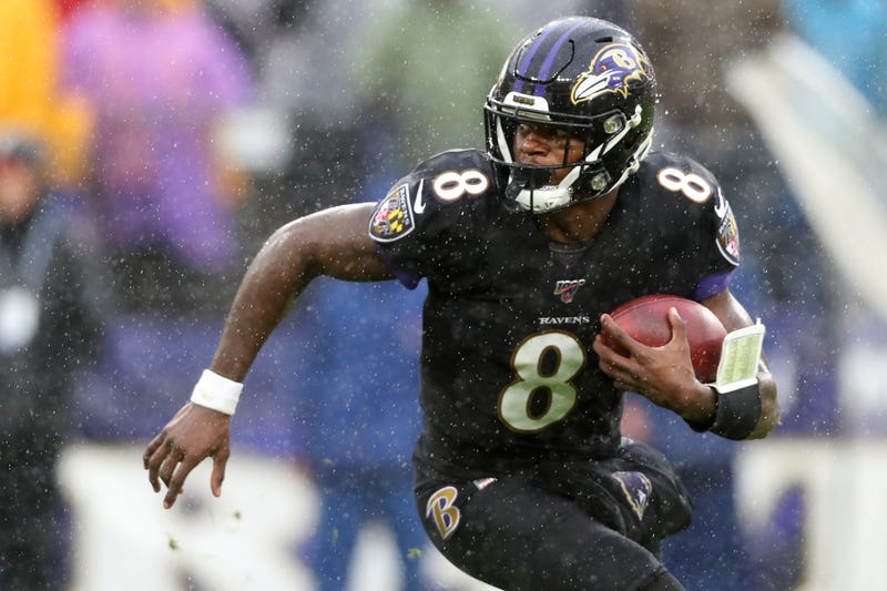 Quarterback Lamar Jackson #8 of the Baltimore Ravens runs with the ball against the San Francisco 49ers in the first half at M&T Bank Stadium on Dec. 1, 2019, in Baltimore.