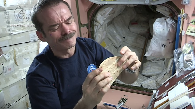 Astronaut Chris Hadfield enjoying a tortilla. (Image: Screen Shot via YouTube)