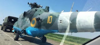 Illustration for article titled Ukrainian Mi-24 Hind Shot Down, Towed Away By Truck