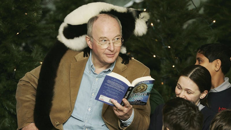 Please enjoy this picture of His Dark Materials author Philip Pullman trying not to look worried that a lemur might be about to poop on him.