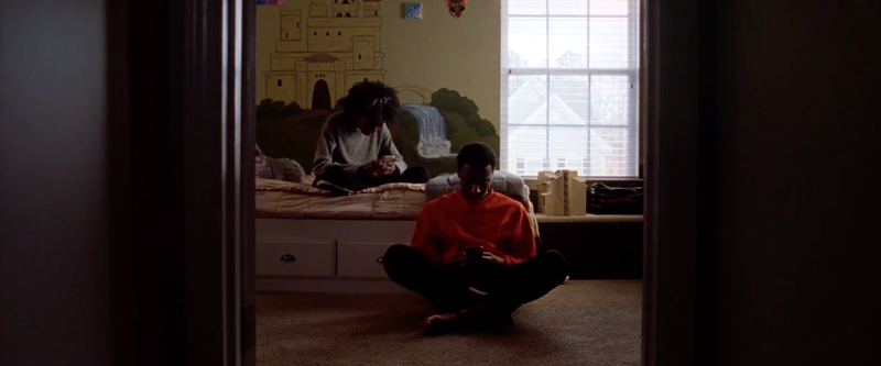 Jerrod Carmichael (right) and a relative