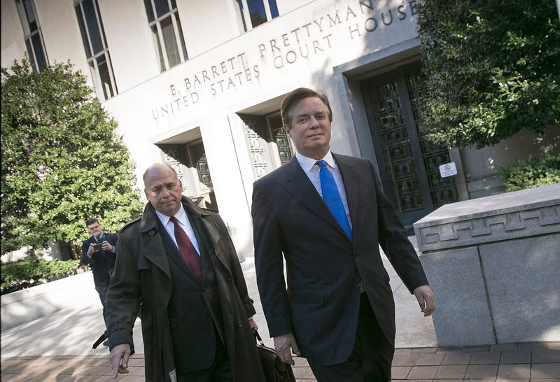 Former campaign manager for President Donald Trump, Paul Manafort (R), leaves U.S. District Court after pleading not guilty following his indictment on federal charges on October 30, 2017 in Washington, DC. Manafort was indicted on charges of funneling millions of dollars through overseas shell companies.