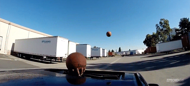 Man does spectacular trick shot through moonroof while driving a car