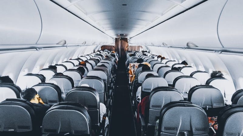 Illustration for article titled How to Lift the Aisle Armrest on an Airplane