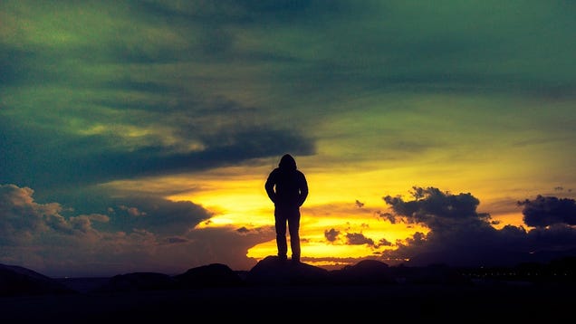 A man standing alone on a mountain.