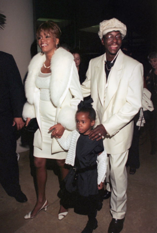 Whitney Houston, Bobby Brown and Bobbi Kristina Brown in 1998 (Lucy Nicholson/AFP/Getty Images)