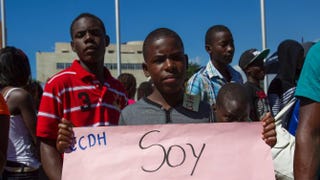 Dominicans of Haitian descent protest outside the House of Representatives in Santo Domingo, Dominican Republic, March 12, 2014, asking for the return of their Dominican identity documents that were canceled by the Central Electoral Board.ERIKA SANTELICES/AFP/Getty Images
