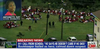 Antoinette Tuff pictured against the backdrop of the school (CNN screenshot)