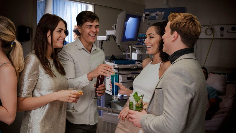 Boston General guests enjoy signature cocktails while mingling with a patient recovering from surgery.