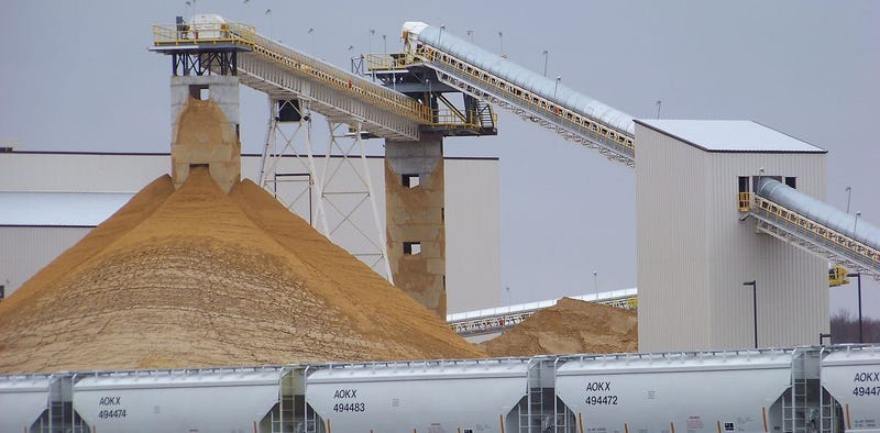 Sand for use in hydraulic fracturing operations at a processing plant in Chippewa Falls, Wisconsin in 2011. AP Photo/Steve Karnowski), Author provided