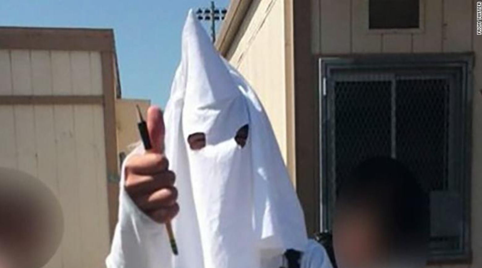 brave kids in kkk outfits
9