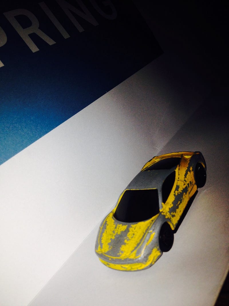 Illustration for article titled Presenting: the most beat-up (but still butt-kicking) 1:64 Ferrari 458 ever
