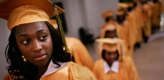 High school celebrates first post-Katrina graduation in June 2007. (Mario Tama/Getty Images News)