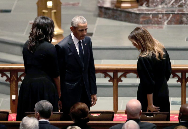 Former President Barack Obama and former first lady Michelle Obama greet first lady Melania Trump at St. Martin’s Episcopal Church during the funeral service for former first lady Barbara Bush on April 21, 2018, in Houston.