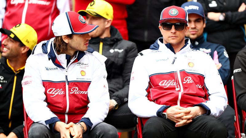 Antonio Giovinazzi (left) and Kimi Raikkonen (right) before the Chinese Grand Prix in April. 