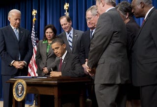 President Obama signs controversial bipartisan tax bill.