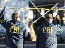 FBI descends on home of pipe-bomb suspect.