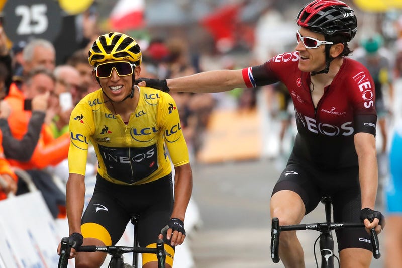 Britain’s Geraint Thomas, right, congratulates Colombia’s Egan Bernal wearing the overall leader’s yellow jersey as they crosses the finish line of the twentieth stage of the Tour de France.