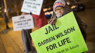 Demonstrators protest the shooting death of 18-year-old Michael Brown across from the police station on Nov. 17, 2014, in Ferguson, Mo.Scott Olson/Getty Images