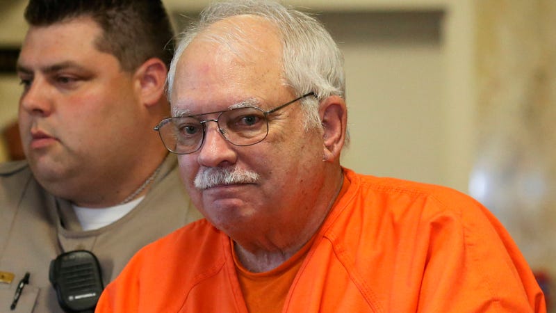 In this May 31, 2016, file photo, Robert Bates, a former Oklahoma volunteer sheriff’s deputy who said he mistook his handgun for his stun gun when he fatally shot an unarmed suspect in 2015, is escorted from the courtroom following his sentencing at the courthouse in Tulsa, Okla.