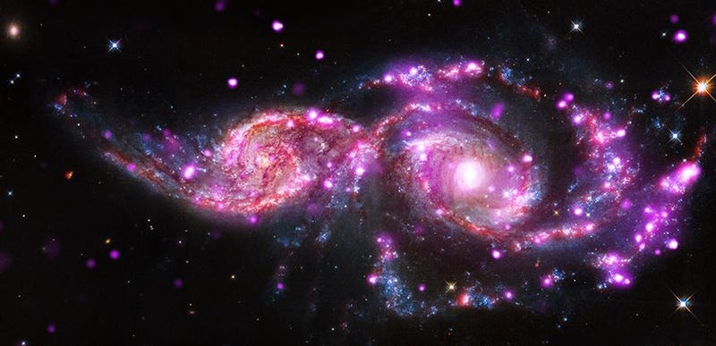 Illustration for article titled This Galactic Collision Is A Beautiful Spawning Ground For Supernovae