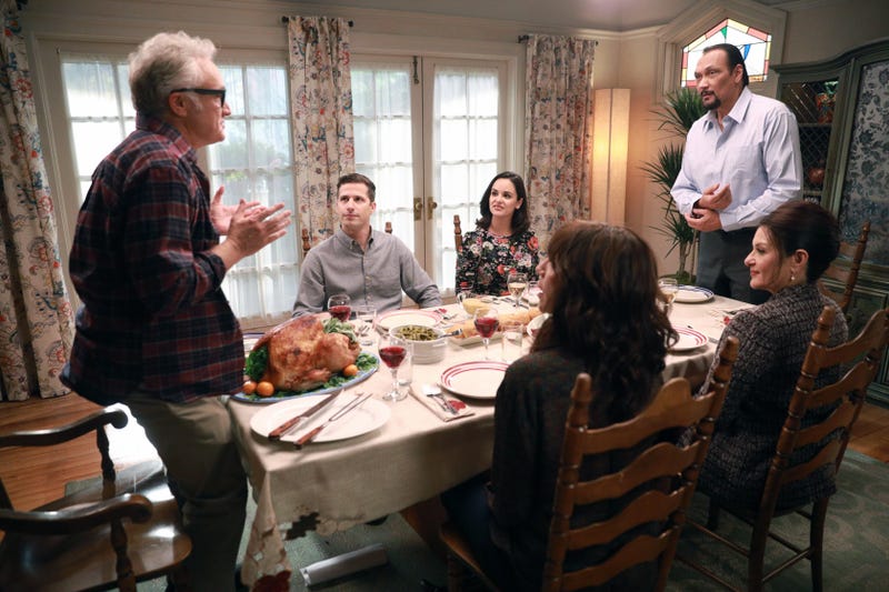Dinner scene between Peralta and Santiago's families in Brooklyn Nine-Nine