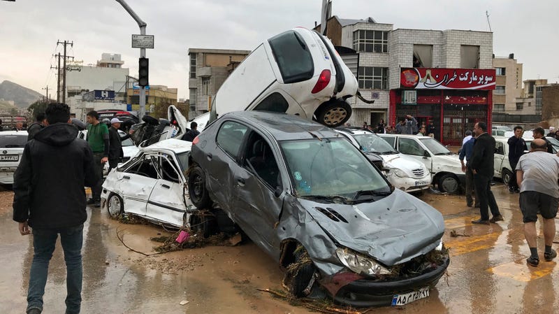 Floodwaters completely wrecked these vehicles Monday, March 26, 2019, in Shiraz, Iran.