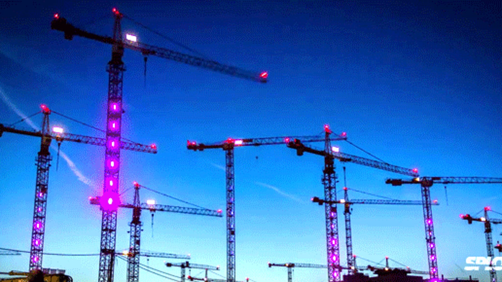 Watch construction cranes come to life and dance in a fun light show