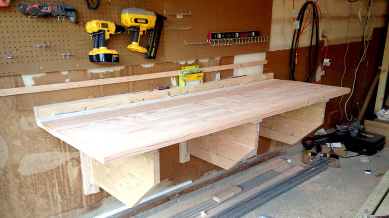 This DIY Floating Workbench Folds Into Place When It's 