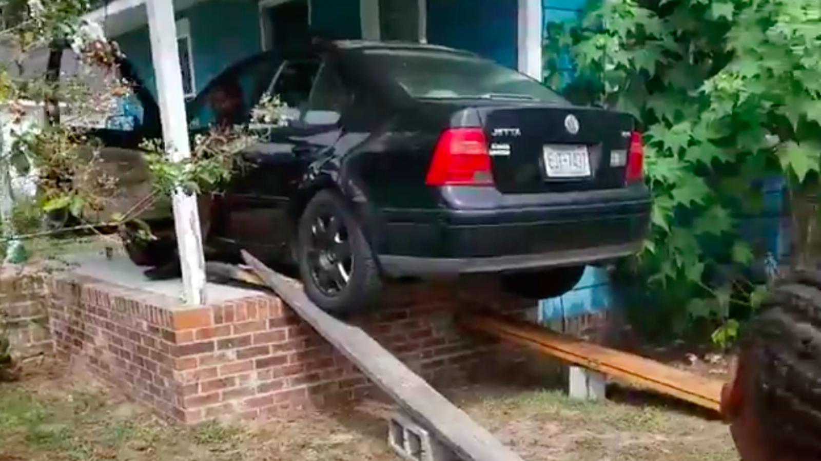 Watch A North Carolina Family Drive a VW Jetta Onto a Porch in Preparation for Hurricane Florence