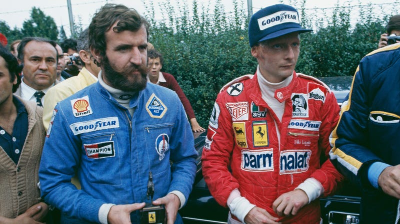 Austrian racing driver Niki Lauda (right) with driver Harald Ertl during the Italian Grand Prix at Monza, 12th September 1976. Ertl helped pull Lauda from the burning wreck of his Ferrari, after his near fatal crash at the German Grand Prix earlier that year. (Photo by Tony Duffy/Getty Images)