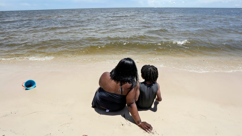 A mother and her son enjoying the sands of Mississippi’s Biloxi Beach in 2018.