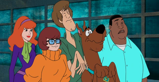 Illustration for article titled Zoinks, Kenan Thompson hangs with Mystery Incorporated in this exclusive Scooby Doo And Guess Who? clip