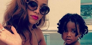 Rihanna and an unidentified child (Instagram via Clutch magazine)