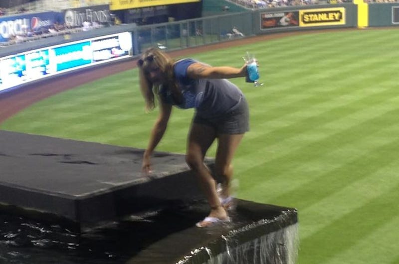 Illustration for article titled Lady Goes For A Stroll Through The Kauffman Stadium Fountain