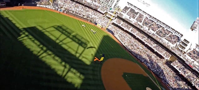 Watch the Navy parachute team jump and land inside a baseball stadium