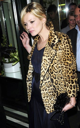 Illustration for article titled Kate Moss Is Either Knocked Up Or Full Of Beer