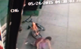 Divan Silva on the ground after being hit by a stray bullet near a barbershop ABCNews/Surveillance Footage