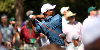 Tiger Woods playing during the Masters on April 13, 2013 (Mike Ehrmann/Getty)