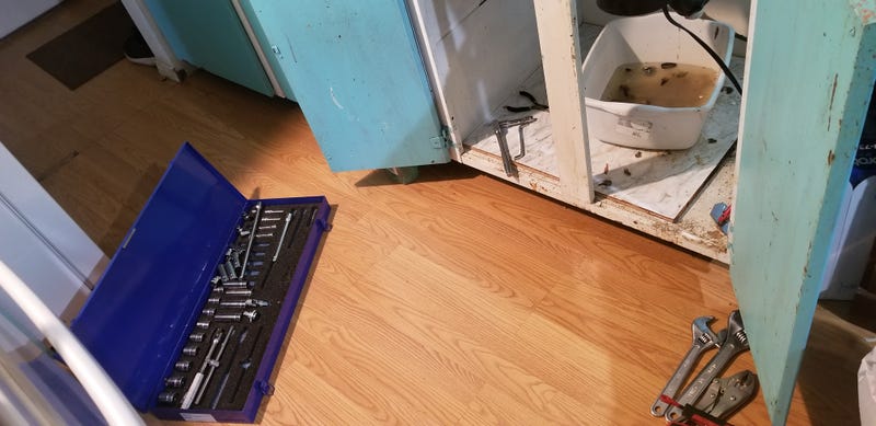 Painting the area under the sink white: great idea.Painting the cabinet doors teal: well... HD was selling 5 gallons of that particular color for $3. I needed something—ANYTHING—to replace the horrendous original off-yellow. And I was broke. Someday I’ll remodel the kitchen