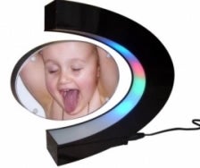 Illustration for article titled Magnetic Floating Picture Frame Won't Make Your Kid Less Ugly