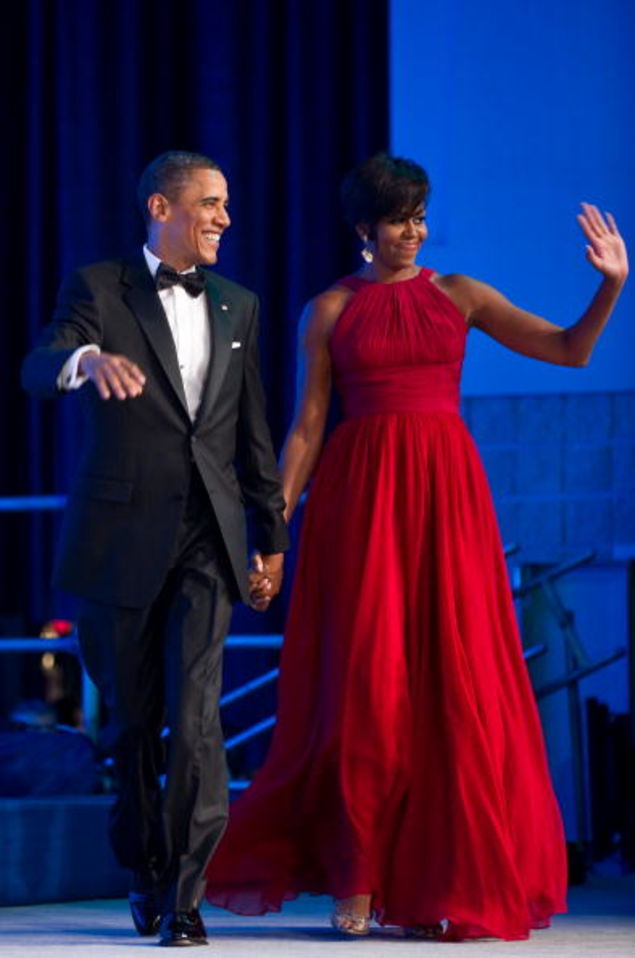 Hi, haters! First lady Michelle Obama, with President Barack Obama, waves as they arrive at the Congressional Black Caucus Foundation Phoenix Awards dinner in Washington, D.C., on Sept. 18, 2010.NICHOLAS KAMM/AFP/Getty Images