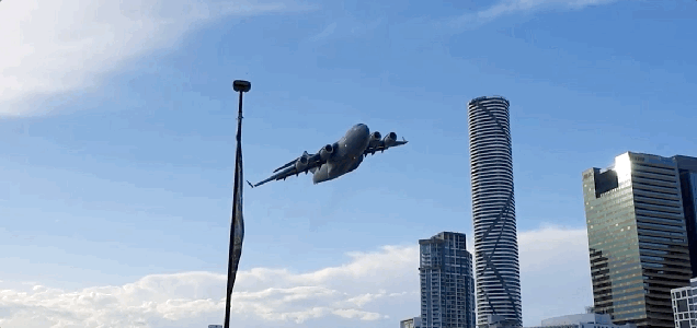 Watch An Australian Air Force Cargo Jet Fly Casually Among Brisbane's Skyscrapers