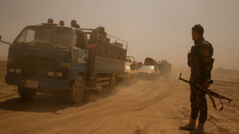 Hundreds of civilians flee villages outside Mosul the day after Iraqi Kurdish forces launch an operation east of Islamic State-held Mosul on Monday, Aug. 15, 2016. 