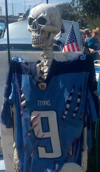 Illustration for article titled Why Yes, Jaguars Fans Tailgated With A Skeleton In A Bloody And Torn Steve McNair Jersey