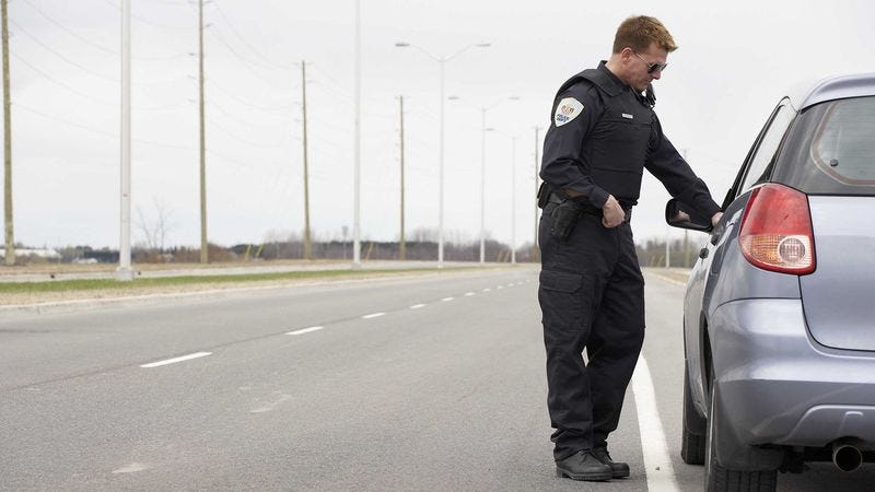 Illustration for article titled Ticketed Motorist Pointing Finger Just The Green Light Cop Needed