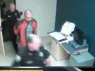 George Zimmerman and police officer (ABC News)