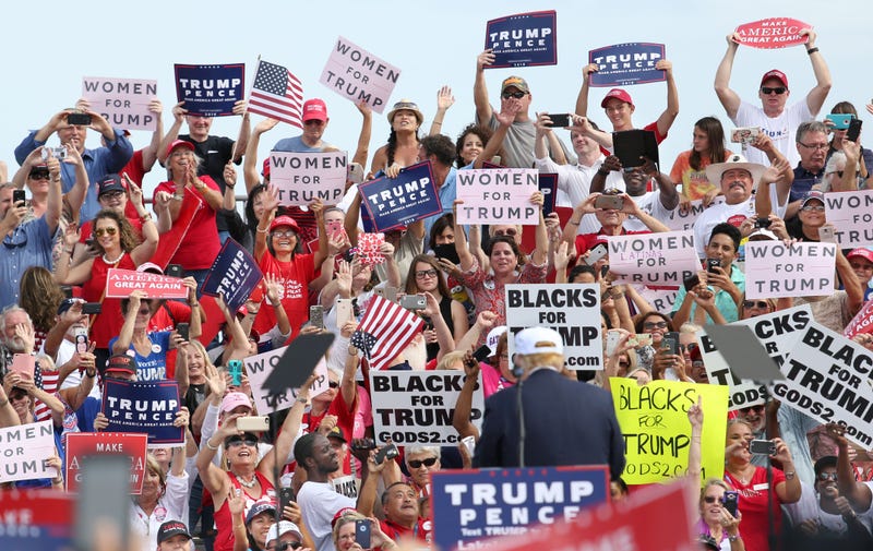 Republican presidential nominee Donald Trump is cheered on by supporters during a campaign stop inside a hangar at Lakeland Linder Regional Airport in Lakeland, Fla., on Oct. 12, 2016. GREGG NEWTON/AFP/Getty Images