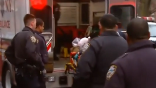 NYPD officer being loaded into an ambulance December 20, 2014Reuters screenshot