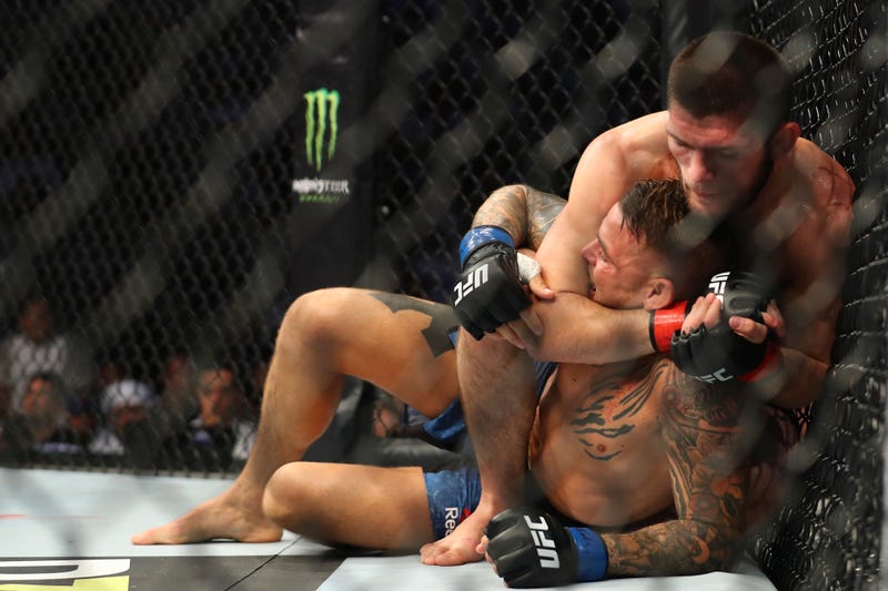Illustration for article titled Khabib Nurmagomedov Remains Terrifyingly Good, Submits Dustin Poirier To Unify Lightweight Championship